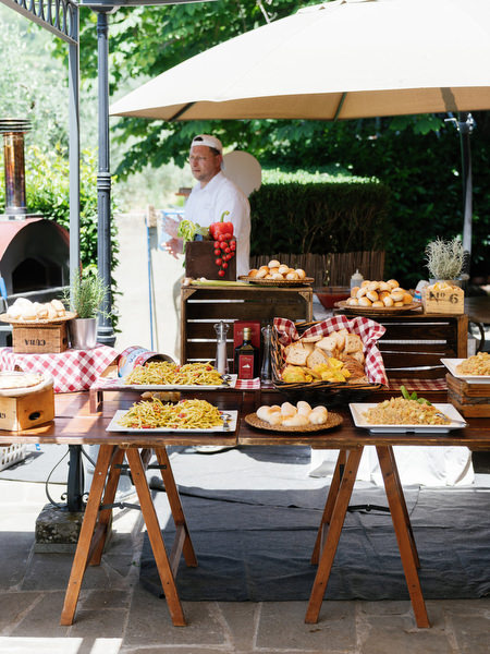Poolside dining table during Tuscany post-wedding celebration