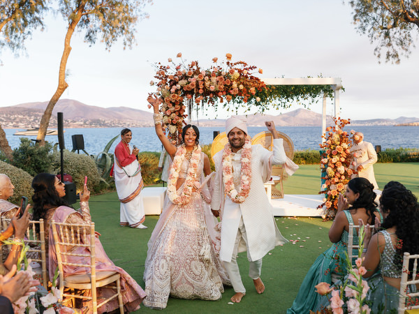 Bride and groom celebrating at the mandap overlooking the sea at Island Resort the Residence