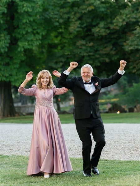 Parents celebrating during Jewish wedding reception at Villa Corsini Tuscany, Florence destination wedding.