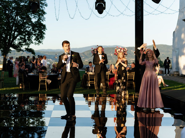 Wedding party dancing under disco balls at Villa Corsini a Mezzomonte reception in Florence.