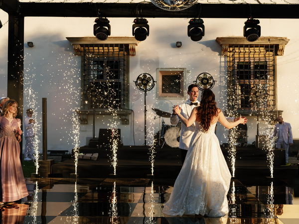 Bride and groom dancing on illuminated dance floor at Villa Corsini Tuscany, luxury Jewish wedding in Florence.