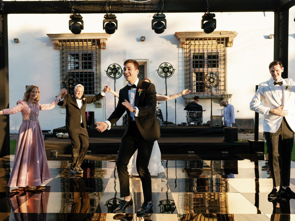 Groomsman dancing center stage during hora at Villa Corsini Tuscany, luxury Jewish wedding in Florence.