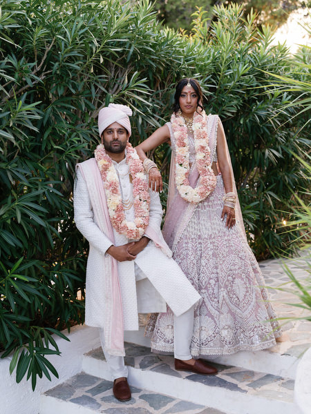 Stylish couple portrait framed by lush greenery at Island Resort the Residence Athens Riviera
