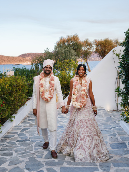 Couple holding hands with sea views at Island Resort the Residence on the Athens Riviera