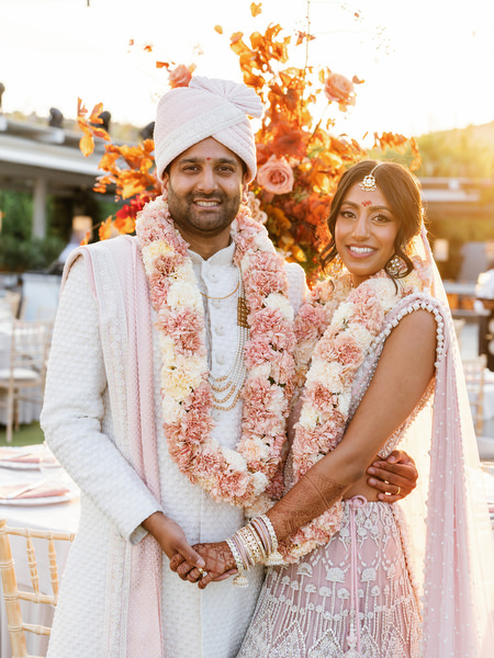 Sunset portrait of bride and groom at Island Resort the Residence during an Indian wedding in Athens