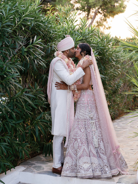 Romantic kiss beneath greenery at Island Resort the Residence Athens Riviera