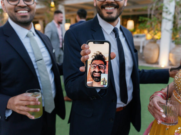 Guest showing Facetime call during reception at Island Resort the Residence Athens