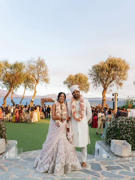 Bride and groom portrait with ceremony lawn and sea views at Island Resort the Residence