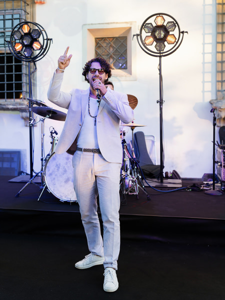 Wedding singer performing on stage at Villa Corsini Tuscany reception in Florence.
