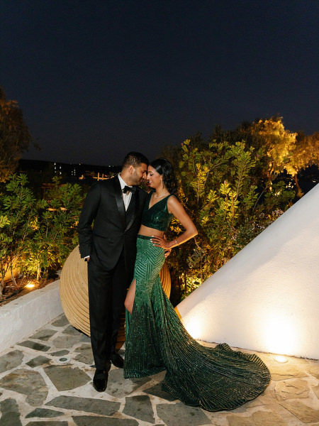 Romantic nighttime couple portrait at Island Resort the Residence overlooking the Athens Riviera