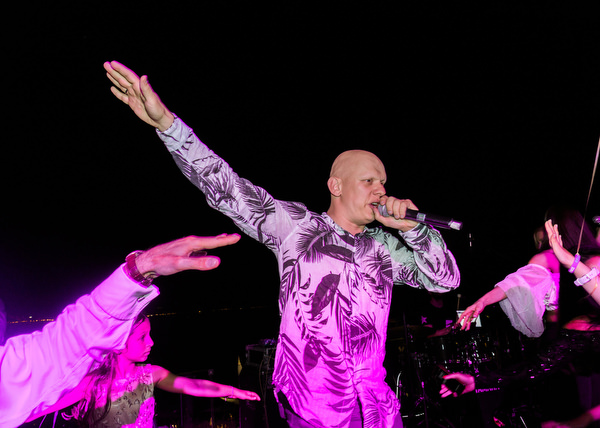 Performer singing during a vibrant Athens wedding reception at Island Resort Athens Riviera
