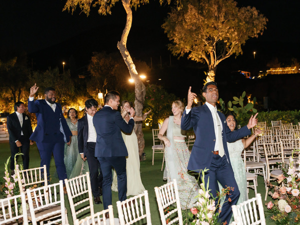 High-energy dance moment under string lights at Island Resort the Residence