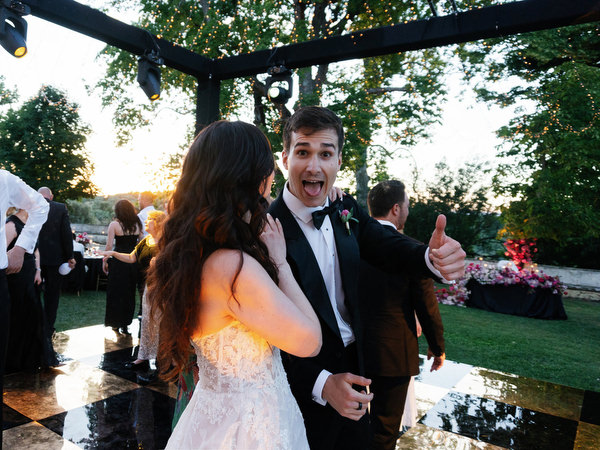 Bride hugging guest during reception at Villa Corsini a Mezzomonte wedding in Florence.