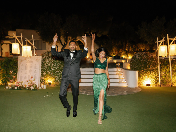 Groom and bride celebration moment on reception lawn at Island Resort the Residence