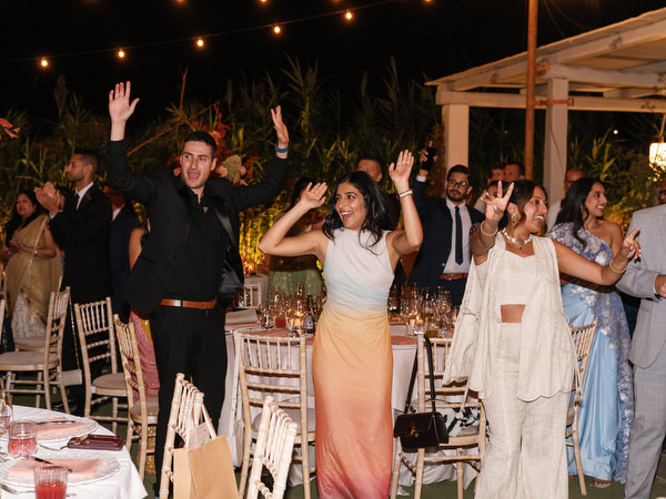 Cheering guests beside reception tables at Island Resort the Residence