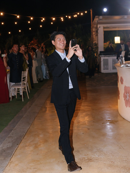 Guest capturing reception moments at Island Resort the Residence at night