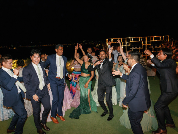 High-energy dance circle during Indian wedding reception at Island Resort the Residence Athens