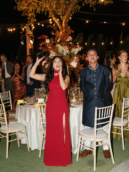 Guests cheering beside reception tables at Island Resort the Residence