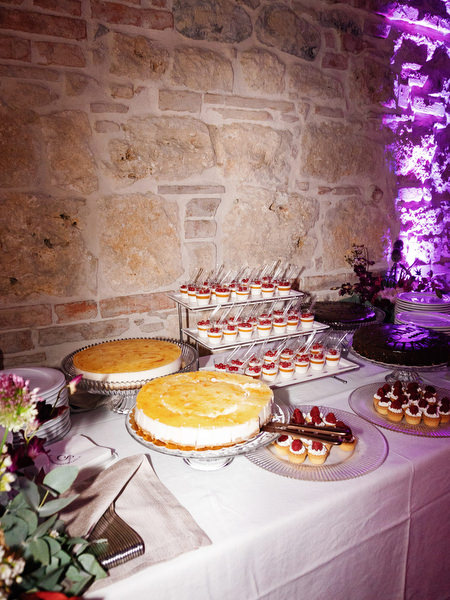 Elegant Italian dessert table with cakes and pastries at luxury Tuscany wedding reception