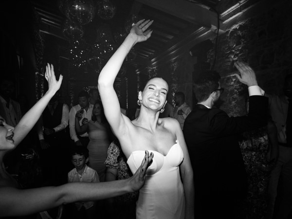 Bride dancing on lively wedding dance floor in Italy