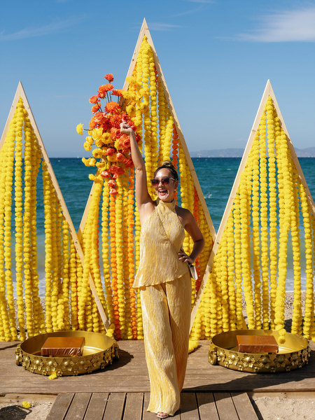 Guest portrait with Haldi ceremony decor backdrop