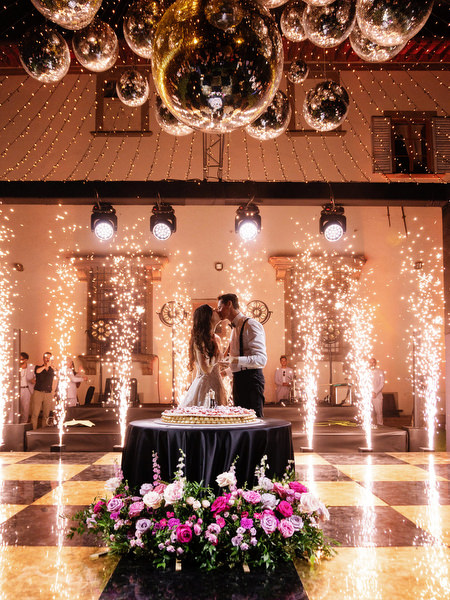 Cake cutting with spark fountains at Villa Corsini Florence luxury wedding reception.