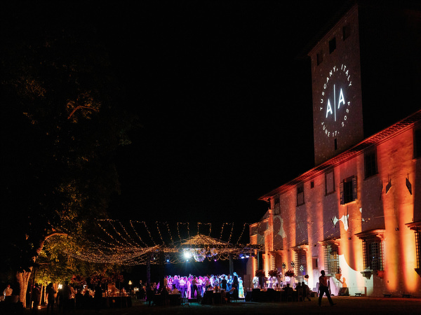Night exterior of Villa Corsini a Mezzomonte illuminated for Florence wedding reception.