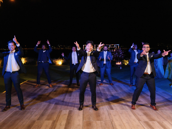 Groomsmen performing dance routine at Island Resort the Residence reception