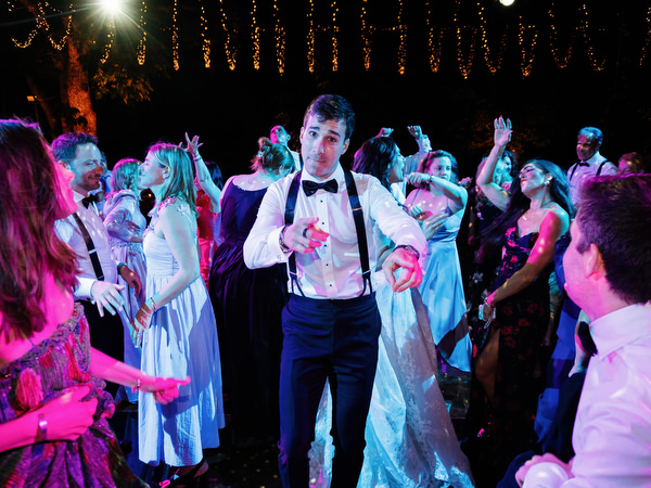 Guests celebrating during high-energy reception at Villa Corsini a Mezzomonte in Tuscany.