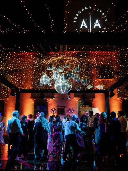 Wide view of illuminated dance floor at Villa Corsini a Mezzomonte Florence wedding reception.