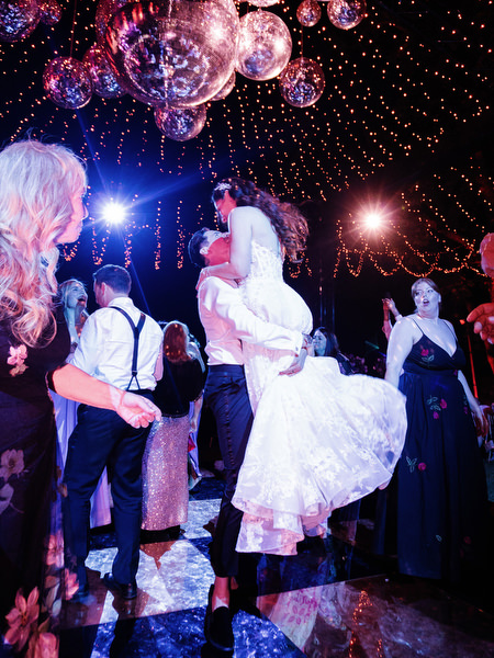 Bride lifted during late-night dance party at Villa Corsini a Mezzomonte Tuscany wedding.