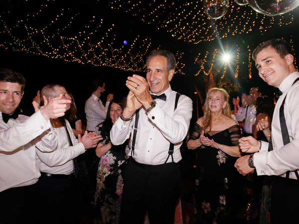 Guests clapping and celebrating on Jewish wedding dance floor in Florence, Tuscany.