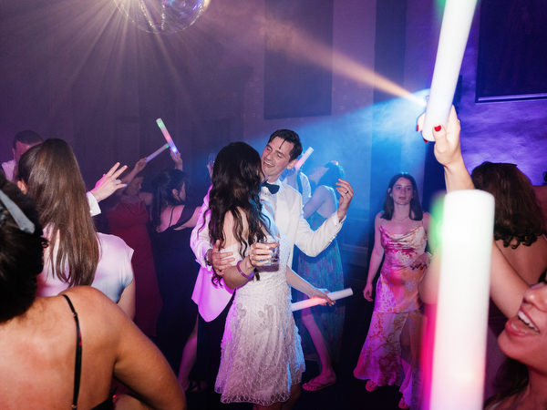 Bride and groom dancing in center of lively Jewish wedding dance floor at Villa Corsini Tuscany.