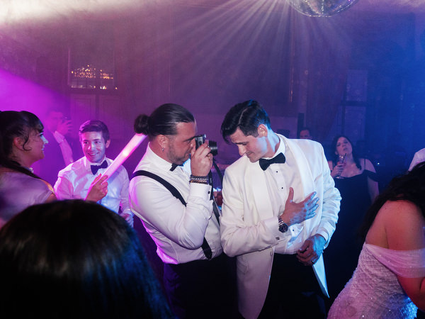 Late-night party moment at Villa Corsini Tuscany with disco balls and string lights.