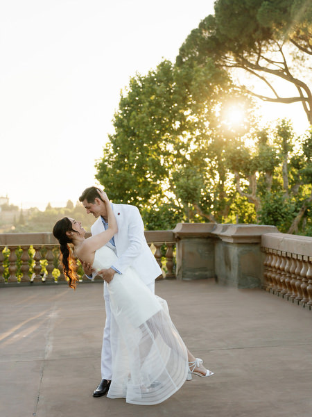 Bride and groom portrait on terrace at Tuscany welcome party