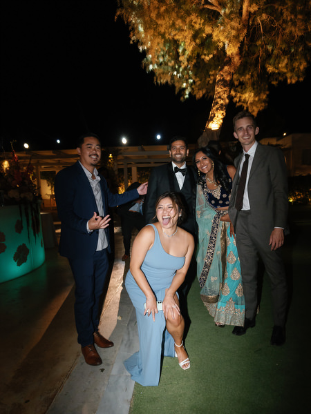 Guests posing and laughing beside reception tables at Island Resort the Residence Athens Riviera
