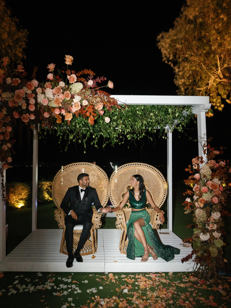 Couple seated beneath floral arch lounge at Island Resort the Residence Athens Riviera