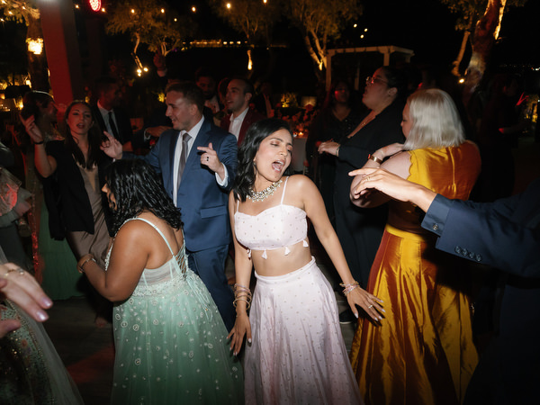 Guests dancing energetically at Island Resort the Residence Athens night reception