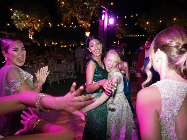 Joyful dance moment under purple reception lighting at Island Resort the Residence Athens Riviera