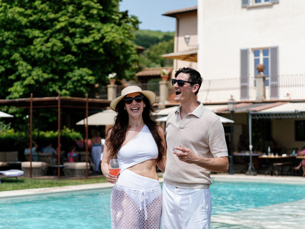 Bride and groom by the pool at Borgo I Vicelli