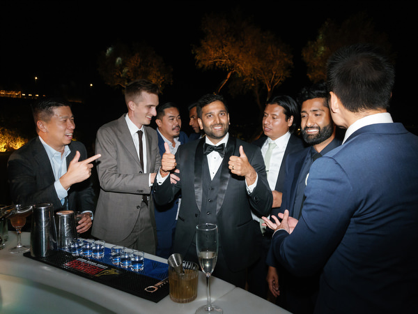 Friends gathered at reception bar at Island Resort the Residence during Athens Riviera Indian wedding