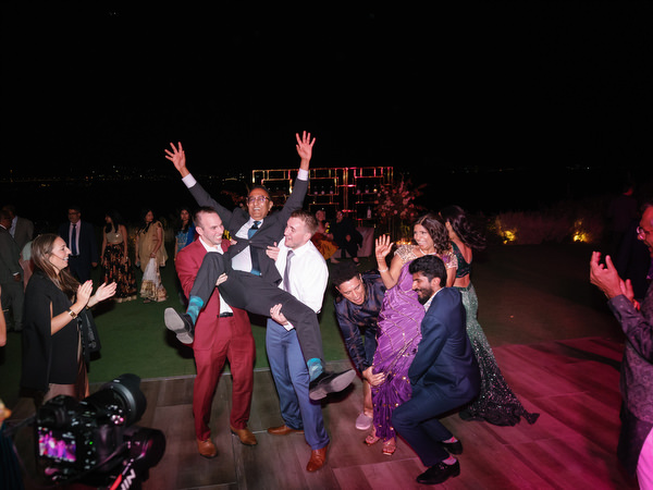 Guests jumping and celebrating on dance floor at Island Resort the Residence