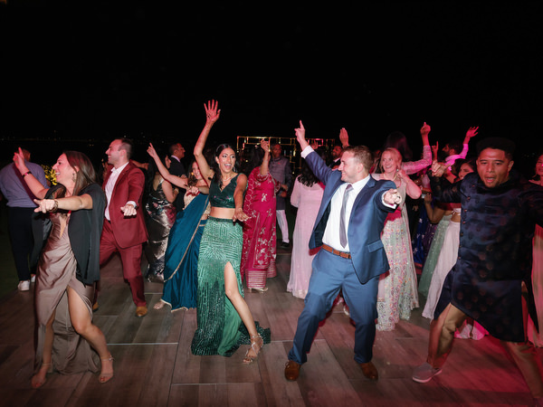 Large group dancing under night sky at Island Resort the Residence Athens Riviera