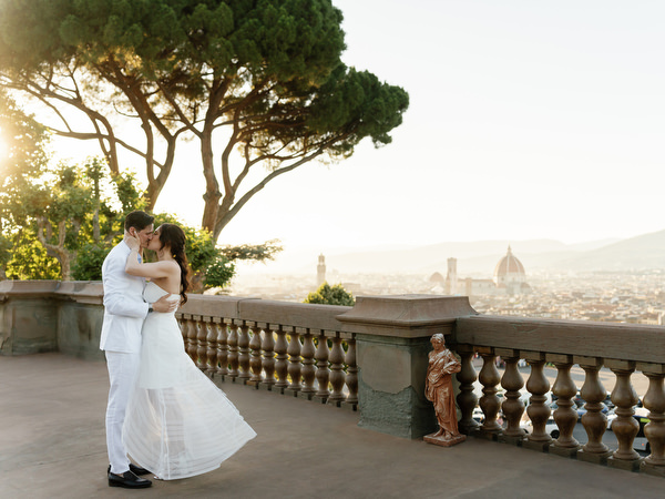 Bride portrait overlooking Tuscan countryside during wedding weekend
