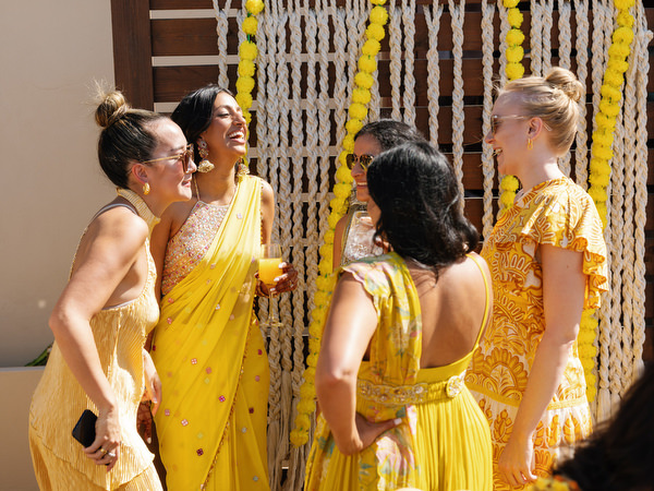Guests mingling during Haldi ceremony celebration in Athens