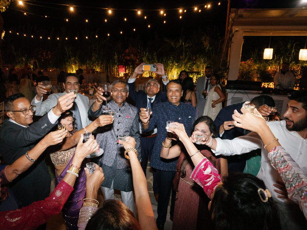 Guests raising glasses in celebration at Island Resort the Residence