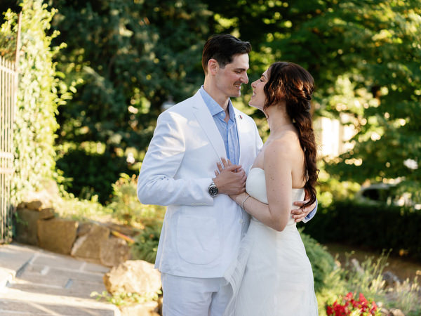 Bride and groom portrait on terrace at Tuscany welcome party