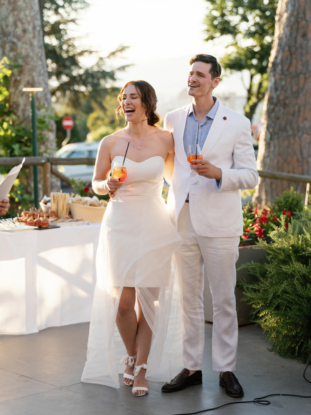 Bride and groom smiling during Tuscany wedding welcome dinner