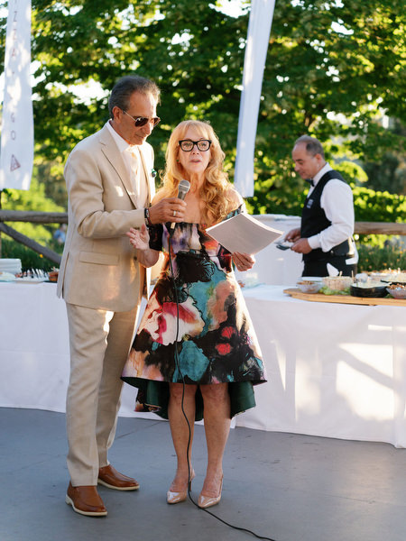 Parents giving toast during Florence destination wedding celebration