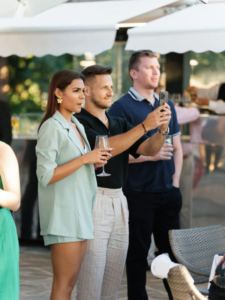 Guests listening to wedding speeches during Tuscany dinner